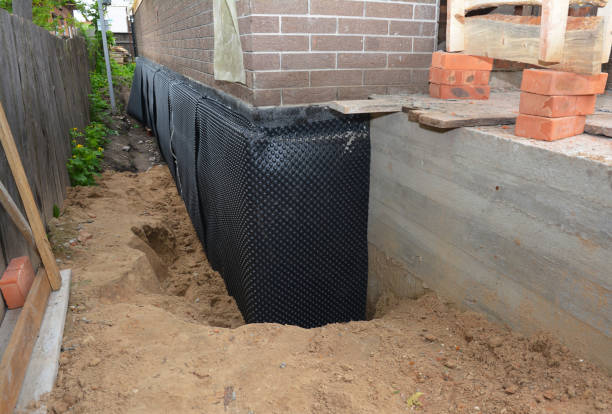 Happy homeowners after waterproofing job in Chestnut Mound